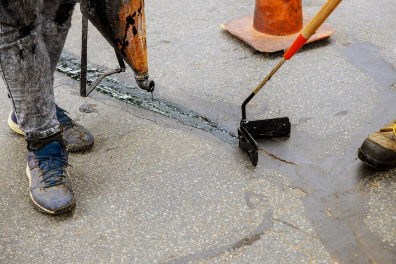 Applying Sealant on a Commercial Lot